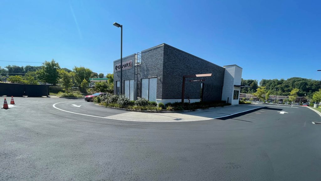 freshly painted arrows for Chipotle parking lot