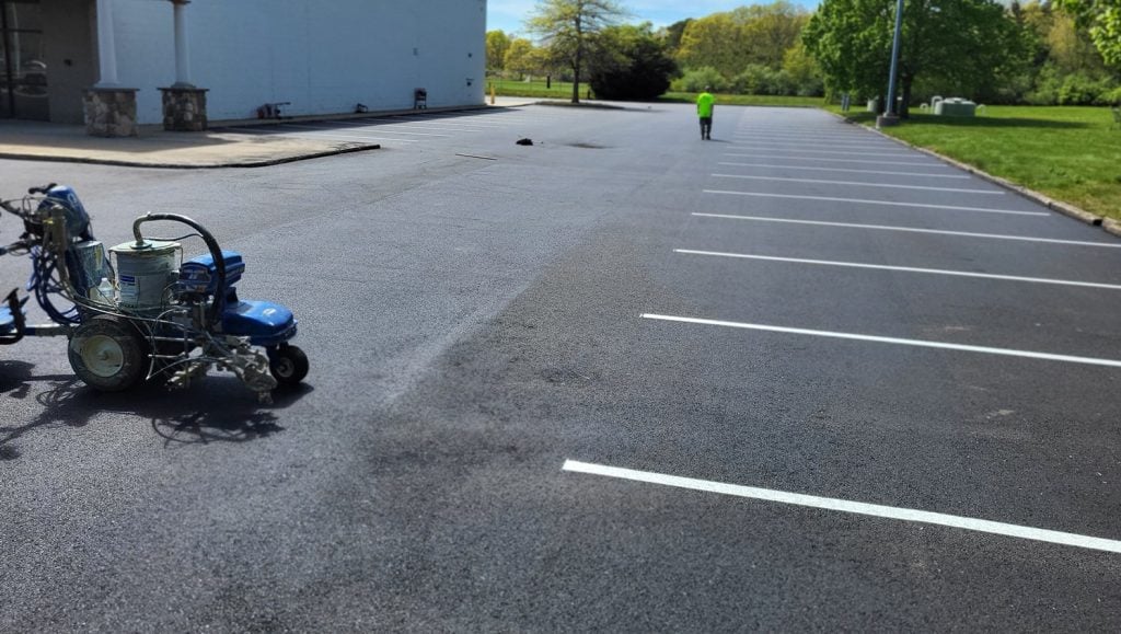 close-up of freshly painted lines for Chamberlain Contractors parking lot