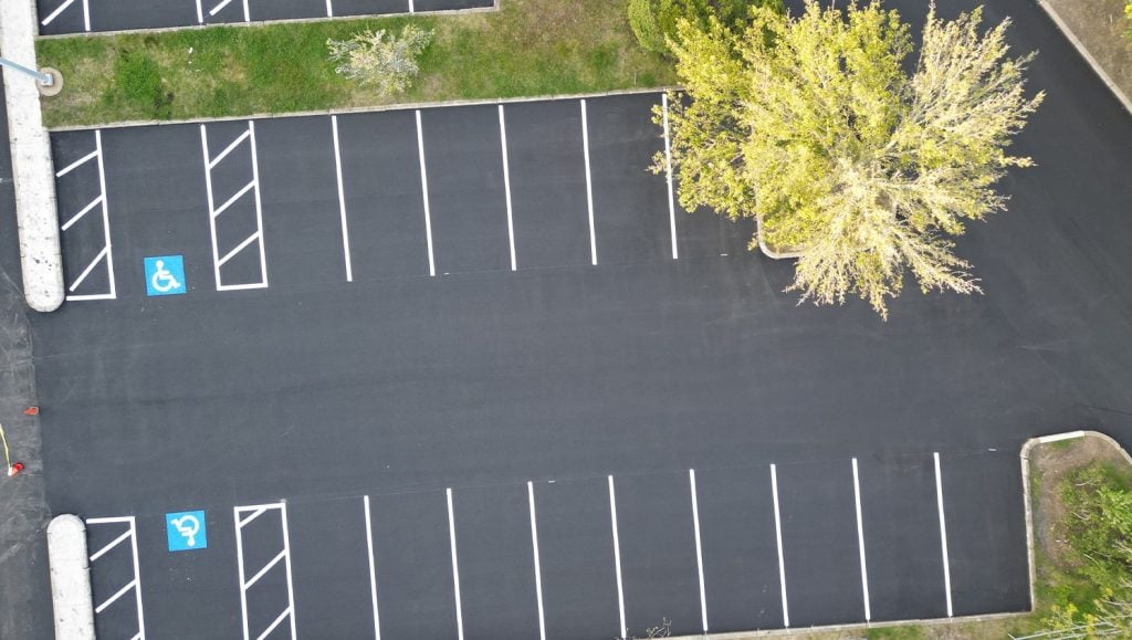 aerial view of freshly painted lines on parking lot for Chamberlain Contractors