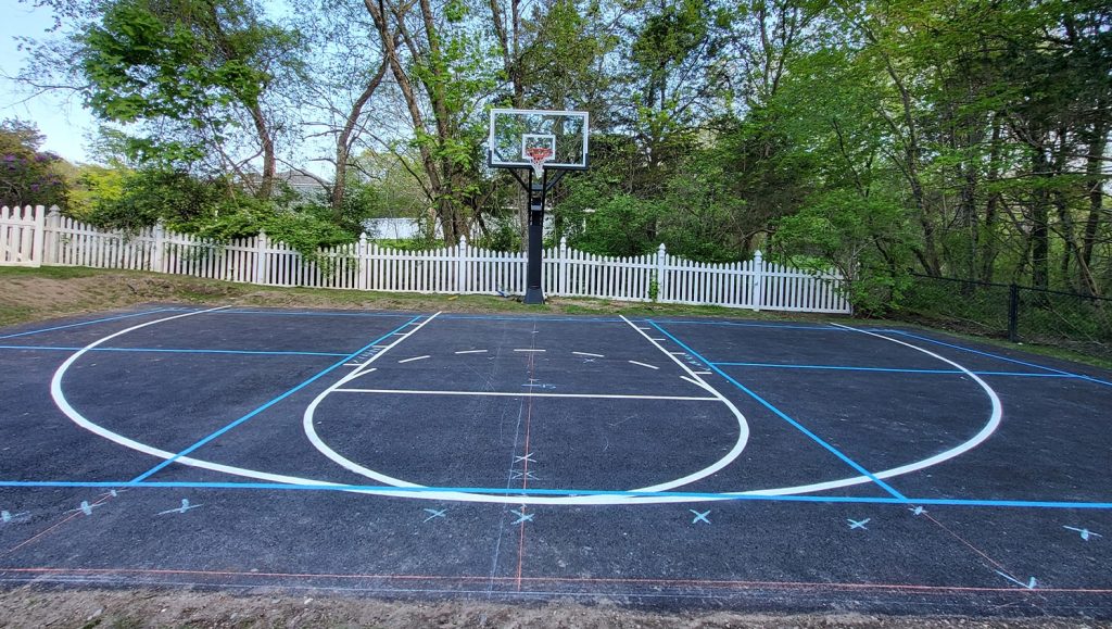 close-up of freshly painted lines for basketball court for Pietrunti Construction