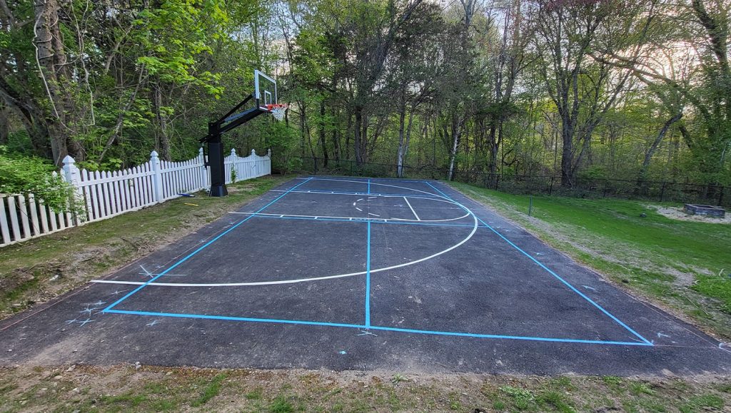 side view of basketball court with freshly painted lines