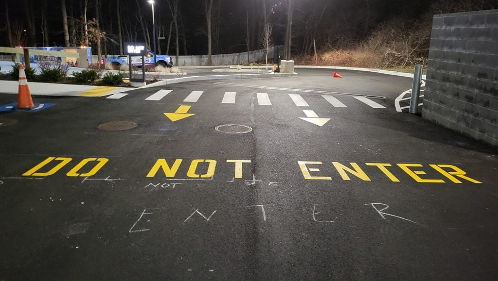 close-up of freshly painted yellow arrows