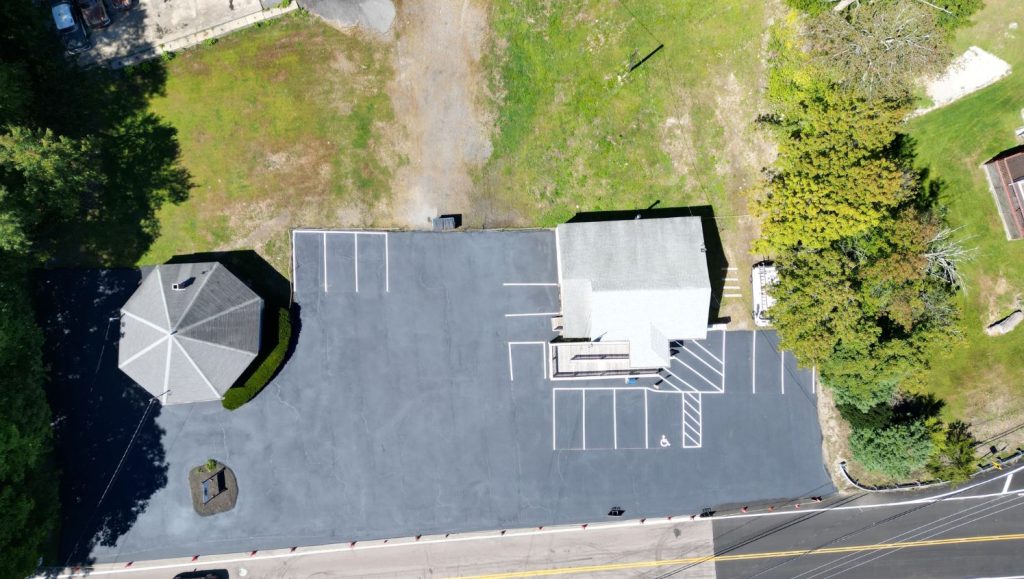 aerial view of post office parking lot with new asphalt