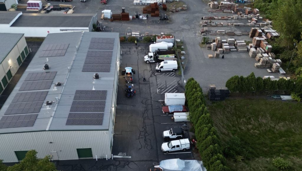 CubeSmart parking lot with freshly sealed cracks aerial view