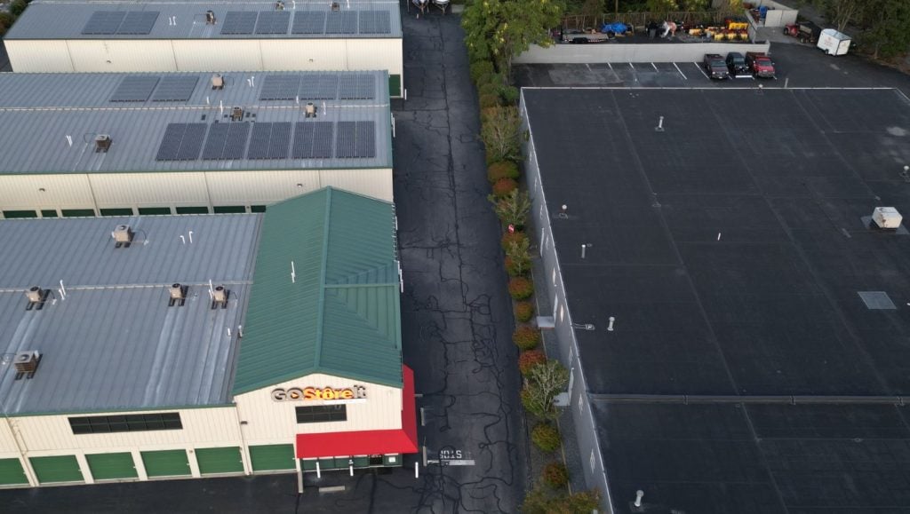 aerial view of CubeSmart parking lot with cracks freshly sealed