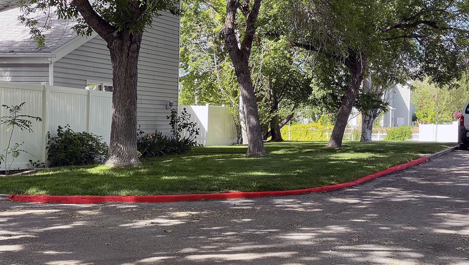 new fire lane curb stripes applied to Millpond Condos pavement in Stansbury Park, UT
