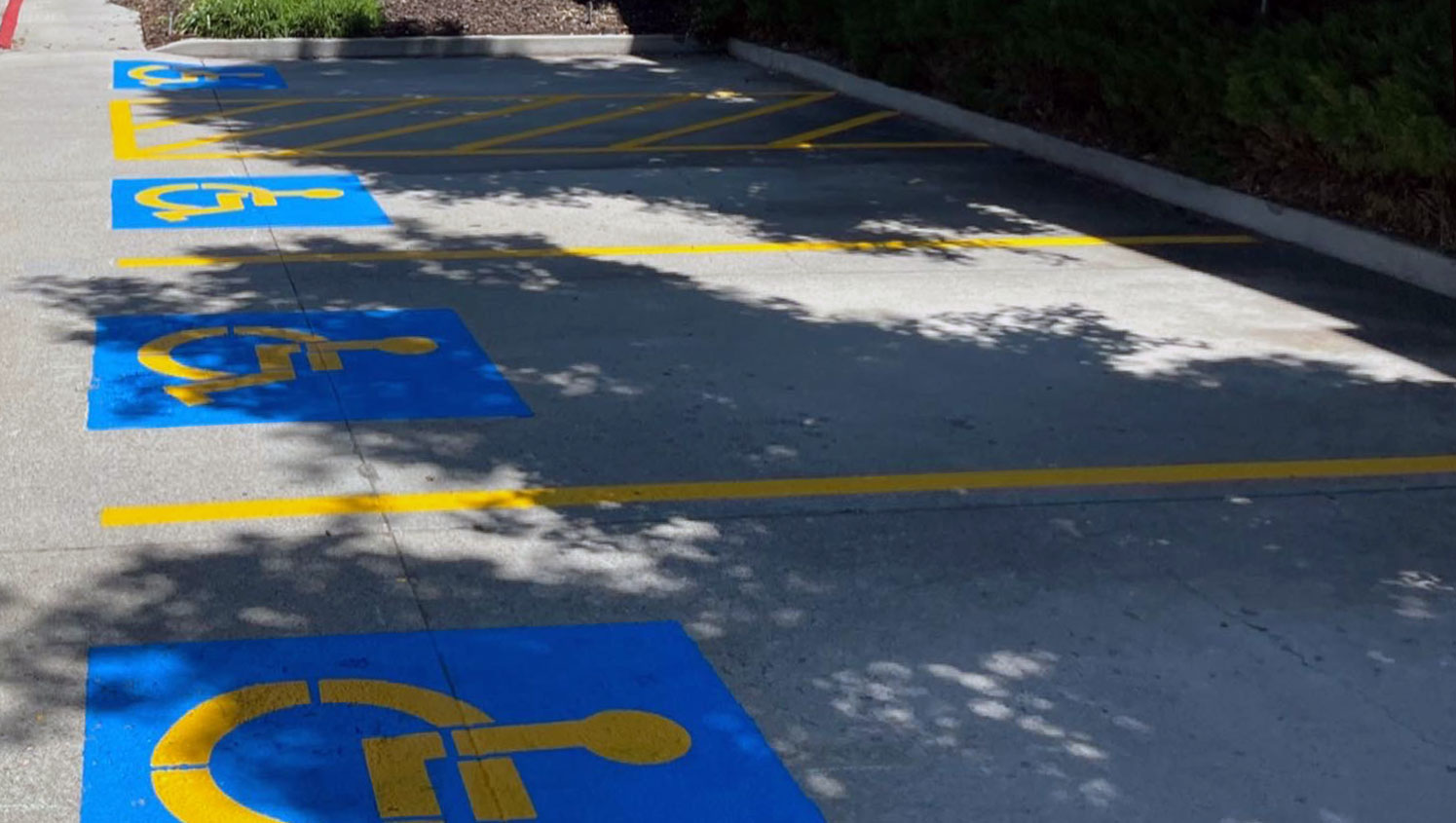 newly striped ADA accessible parking stalls at Pacifica Senior Living Center in Salt Lake City, UT