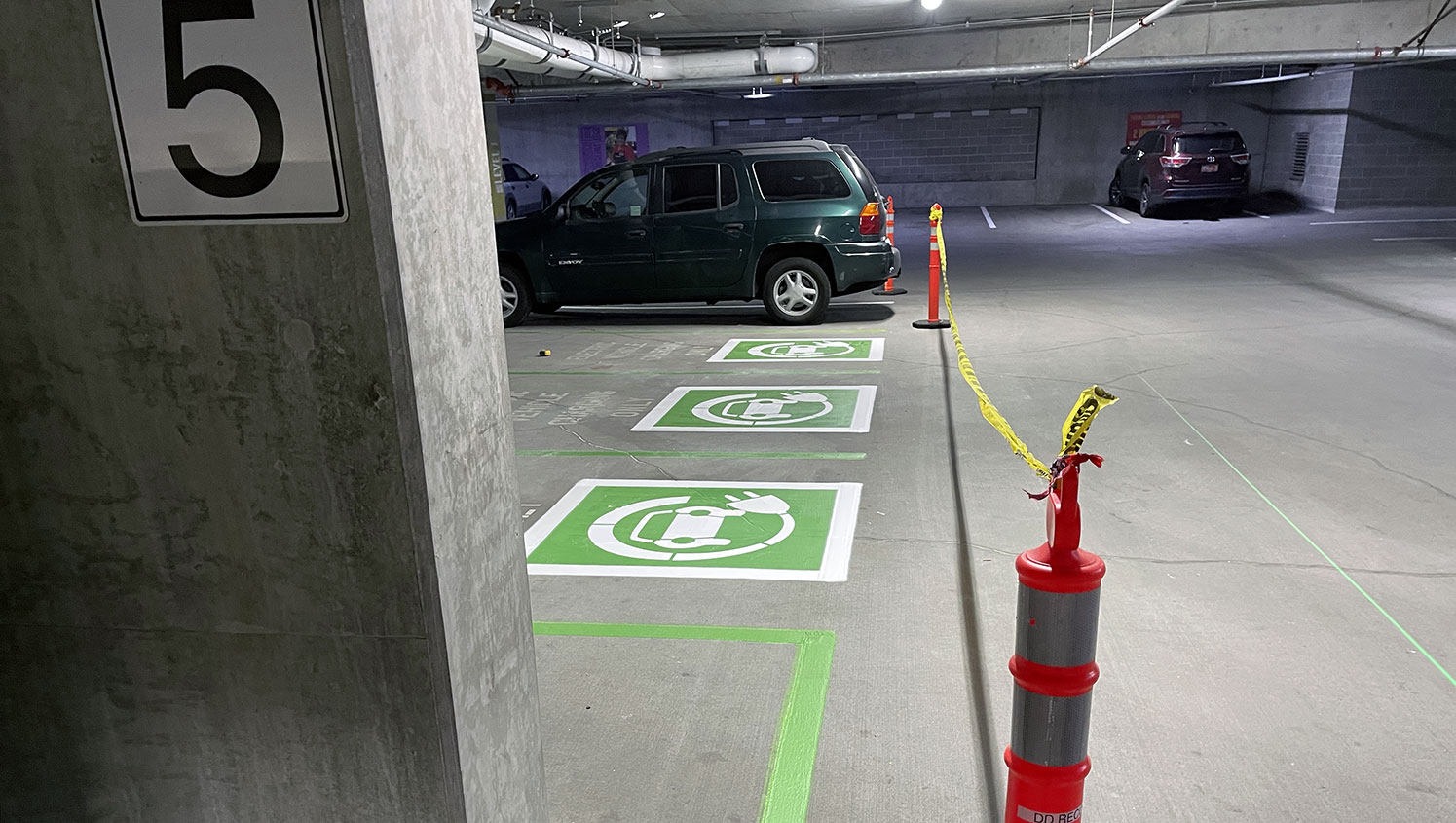 freshly striped electronic vehicle charging station stalls