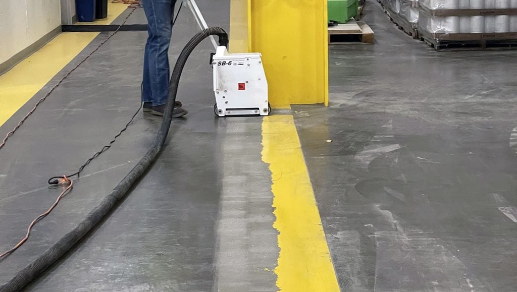 crew member preparing to use line removal equipment