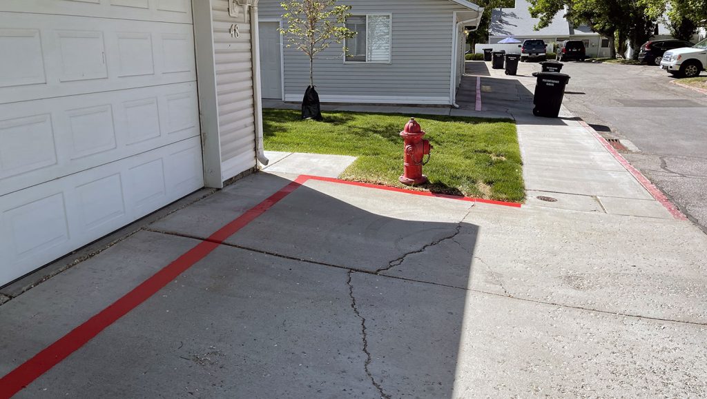 fire lane striping applied to pavement at Millpond Condos in Stansbury Park, UT