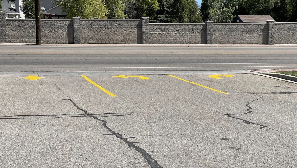 new line striping in entrance & exit lanes of church