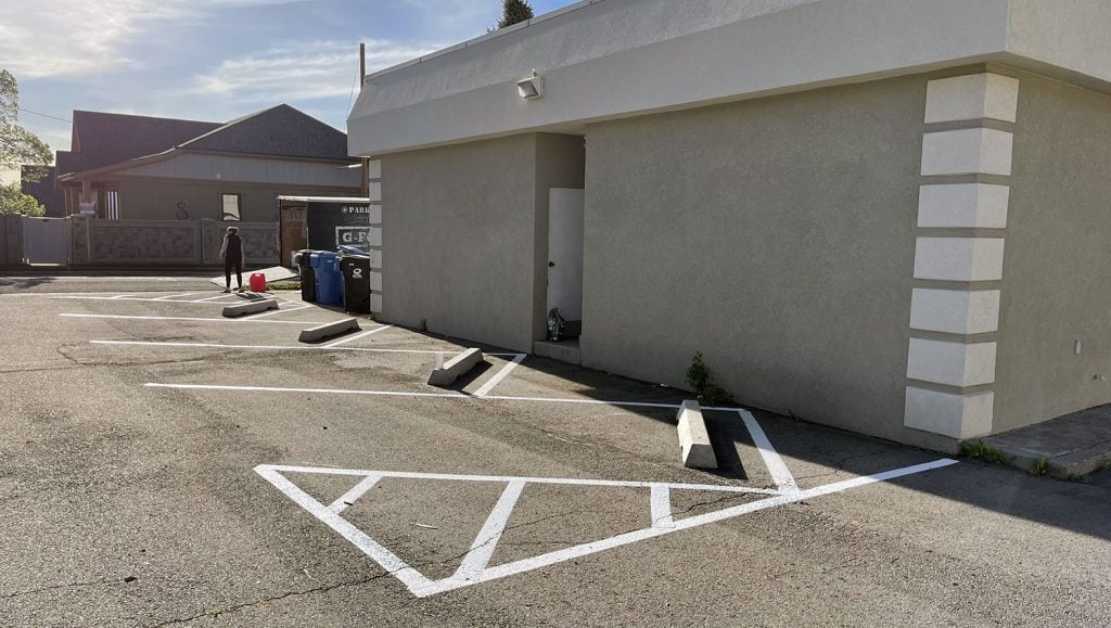 restriped parking spaces at Rising Health Specialty Clinic in Millcreek, UT