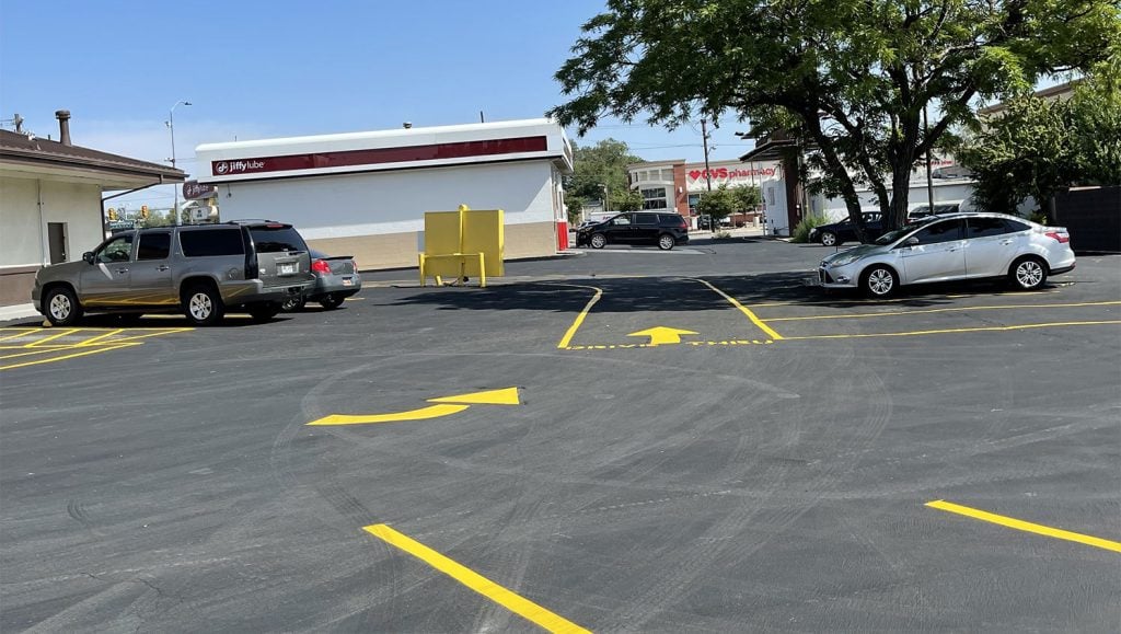 freshly striped parking lot arrows at Racherito’s Mexican Food in West Jordan, Utah