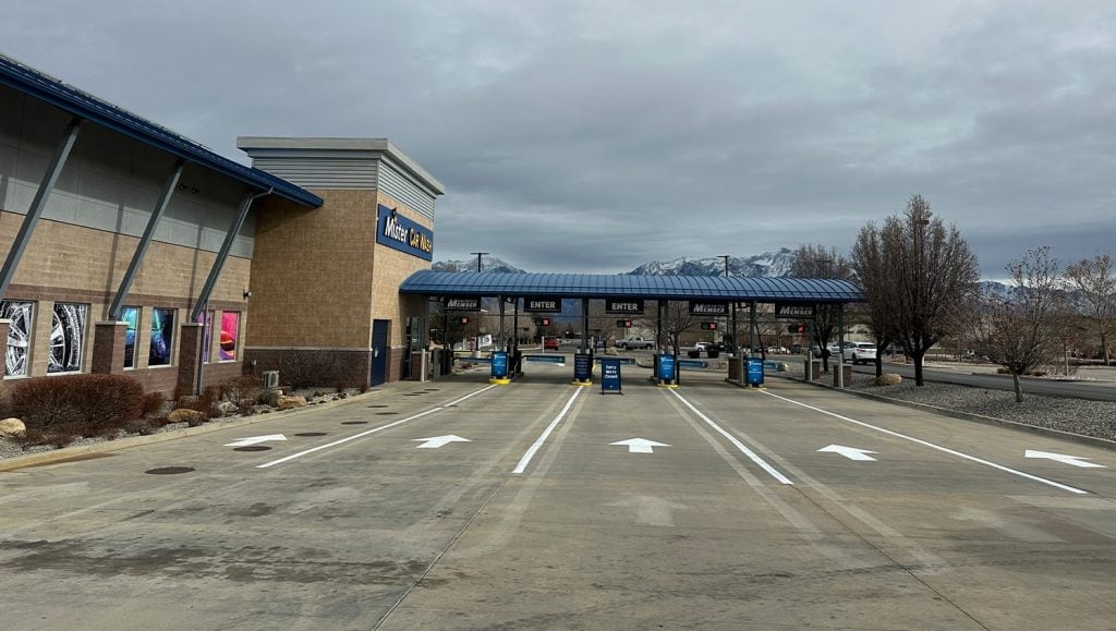 front view of Mister Car Wash parking lot freshly painted