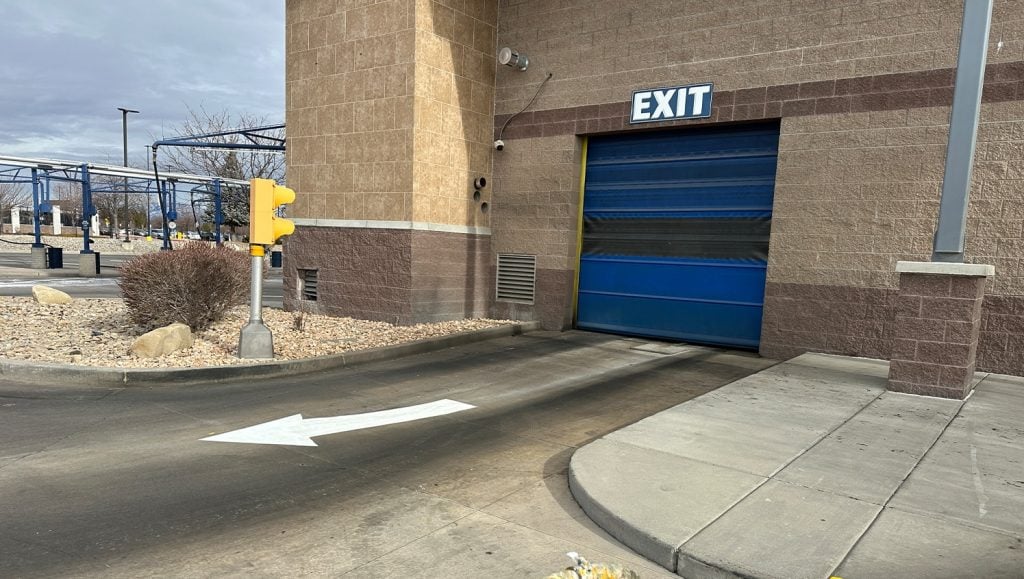 Mister Car Wash exit with a freshly painted white arrow