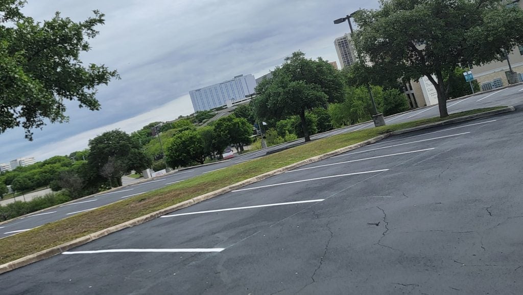 close-up of striped parking lot lines at medical clinic