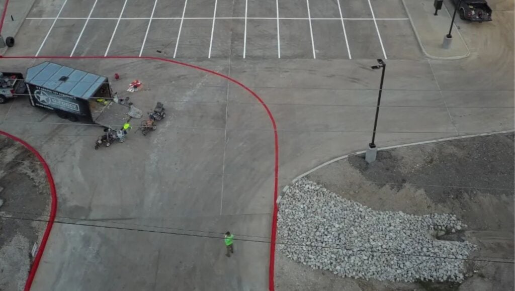 aerial view of HEB Fuel parking lot with freshly painted parking spots