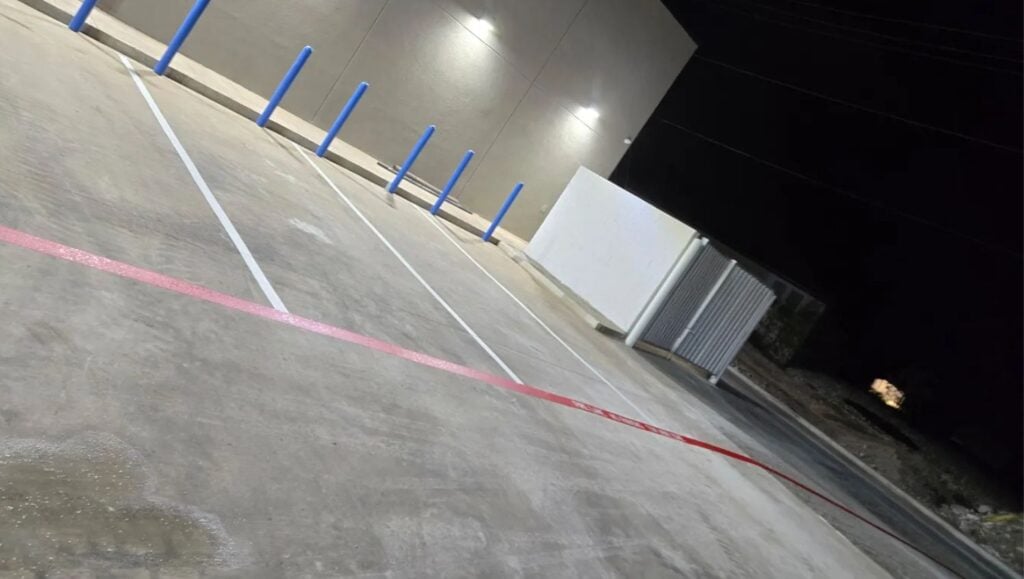 close-up of parking spots freshly painted for HEB Fuel