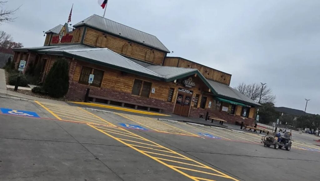 ada compliance parking spots freshly painted for Texas Roadhouse parking lot