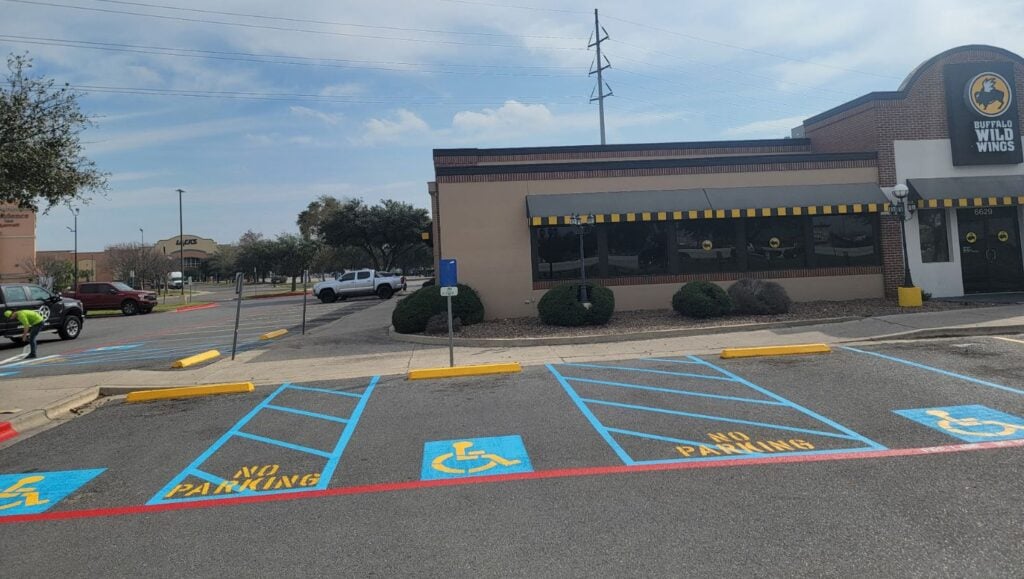 ada compliance parking spots freshly painted for Buffalo Wild Wings parking lot