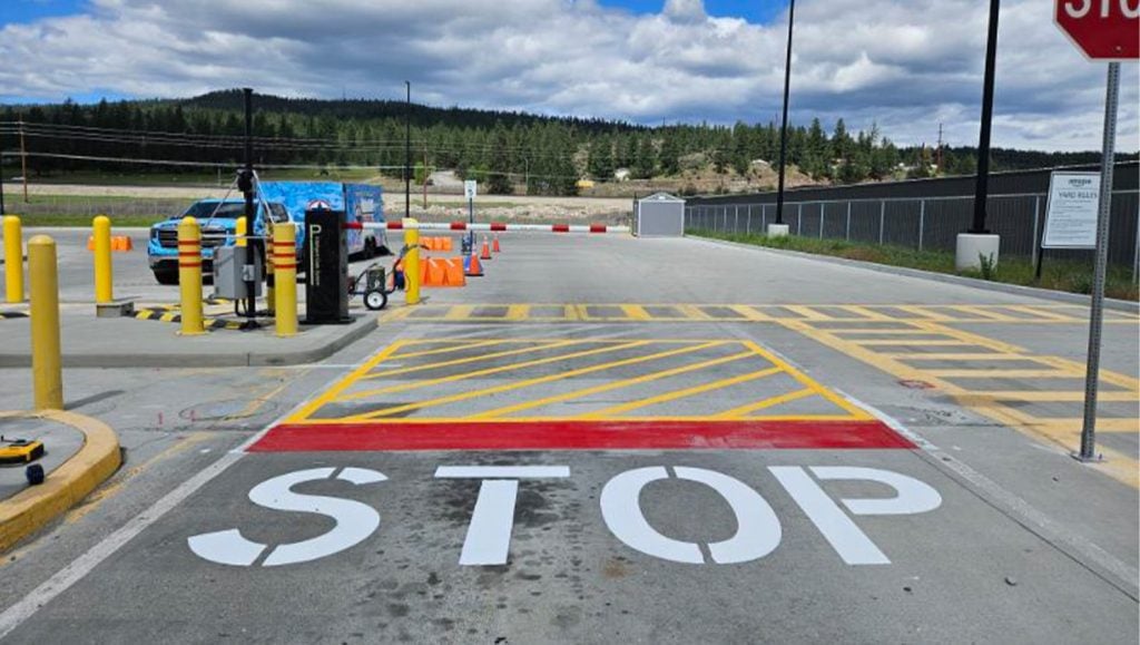 freshly painted lines and "stop" for amazon parking lot