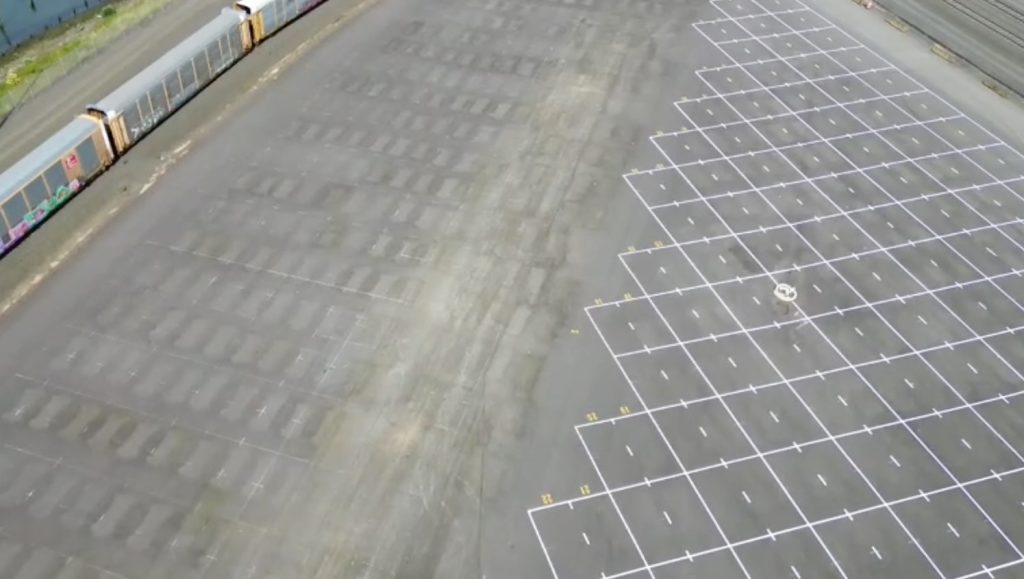 aerial view of parking lot with freshly painted lines