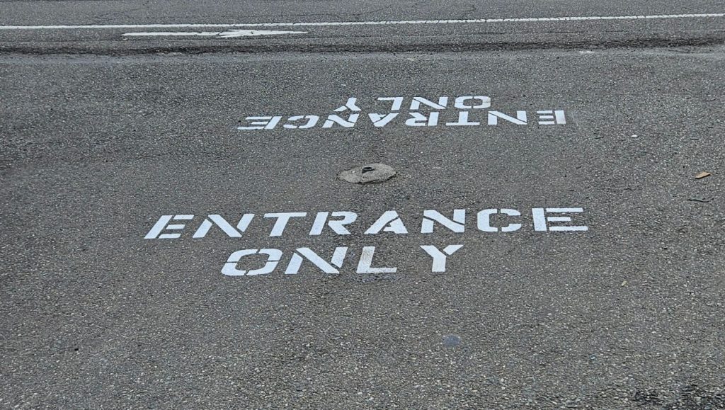 entrance only markings freshly painted for Everguard Fence Materials parking lot