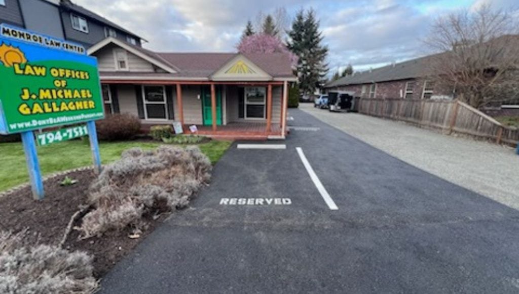 front view of Gallagher Law Office parking lot with freshly painted parking spot