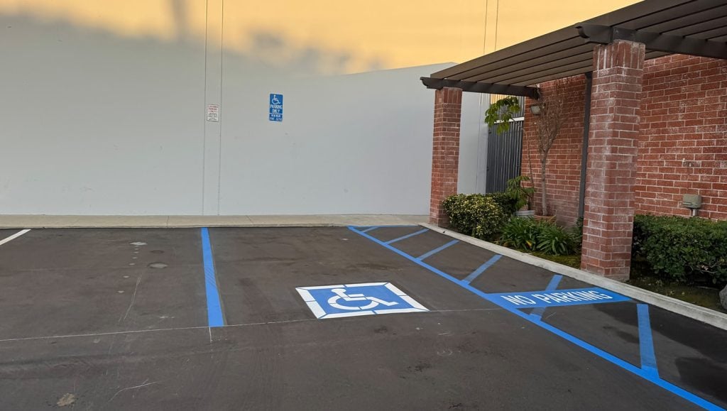 ada compliance parking spot freshly painted for John Padgett Design and Construction