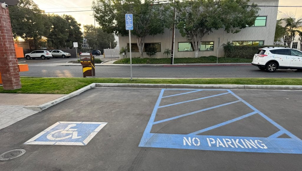 John Padgett Design and Construction parking lot with a freshly painted ada compliance parking spot