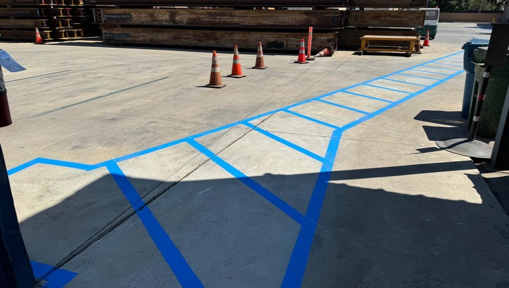 close-up of ada compliance line markings for Trench Shoring parking lot