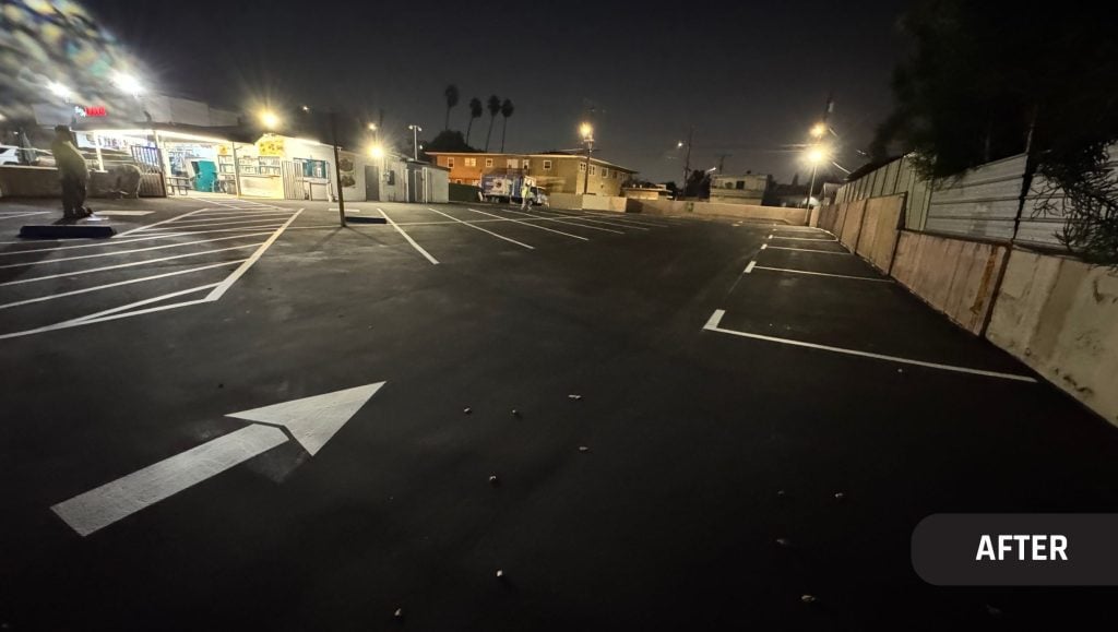 freshly painted line markings forr Moe’s 2 parking lot at night time