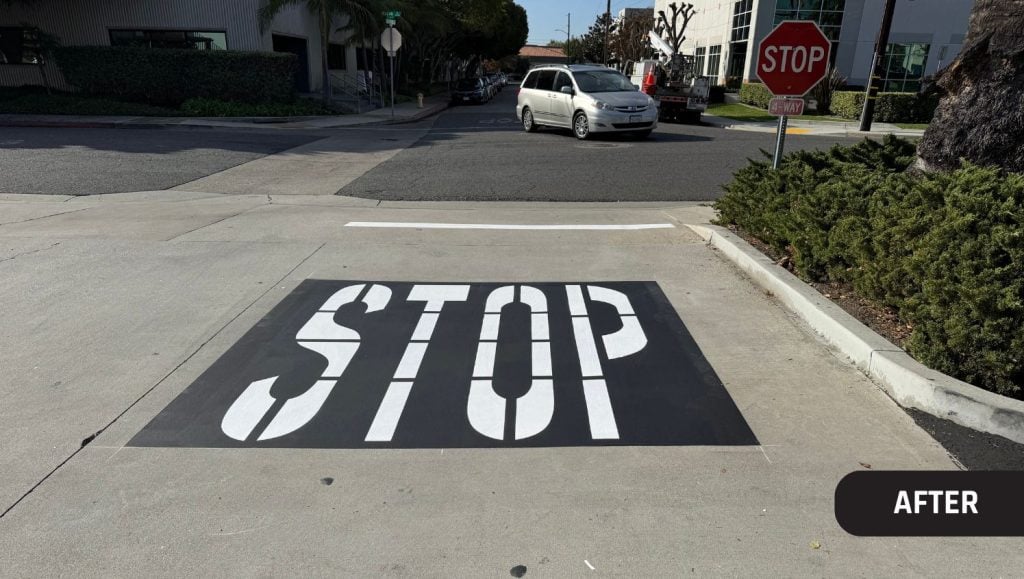 "stop" freshly painted on John Padgett Design and Construction parking lot