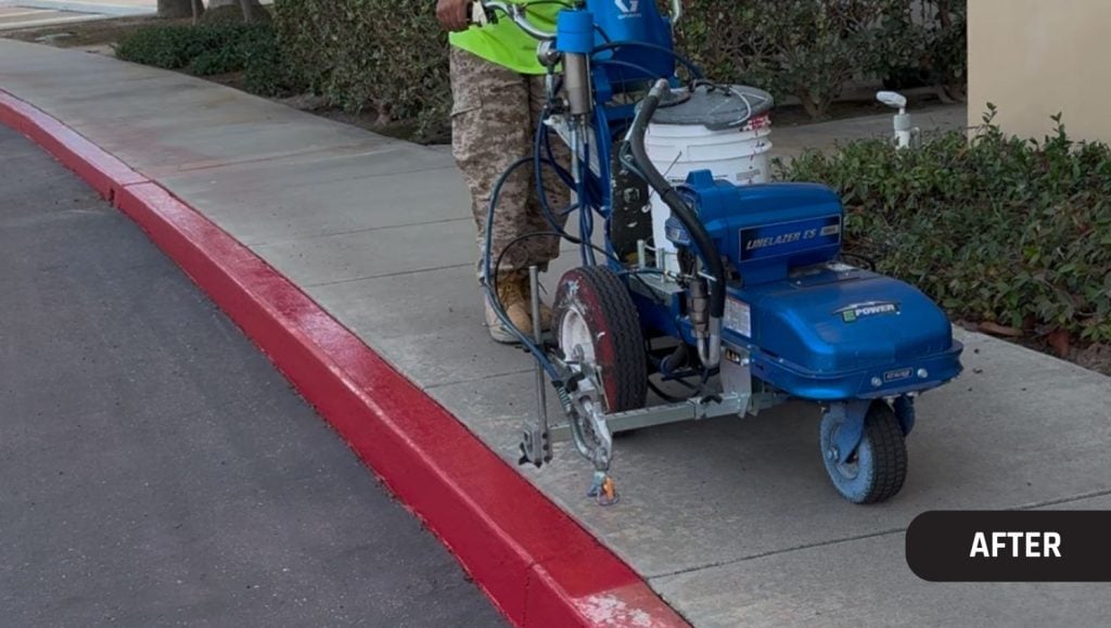 close-up of G-FORCE employee painting fire lane at OST Omnitron Systems