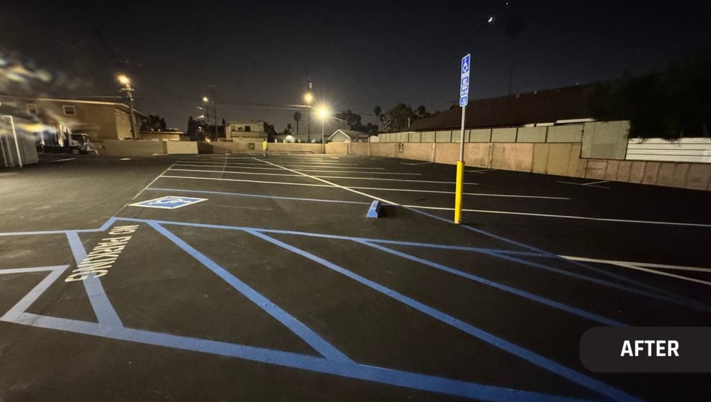 Moe’s 2 parking lot freshly painted at night time