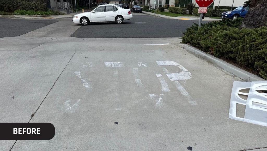 faded "stop" on John Padgett Design and Construction parking lot