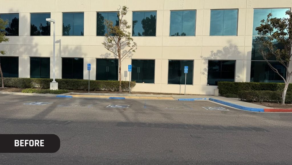 OST Omnitron Systems parking lot with faded parking spots