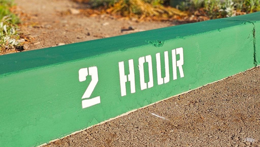 close-up of 2 hour curb painting for Anytime Fitness parking lot