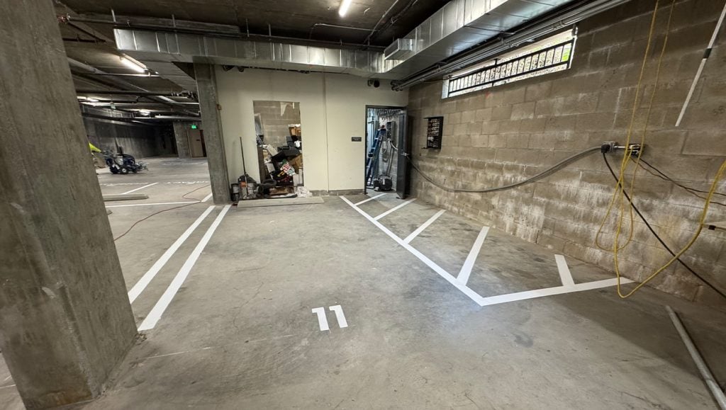 close-up of freshly painted parking spots for. EZ Remodeling parking garage