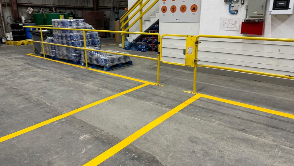 two freshly painted striped lines for CEMEX parking lot