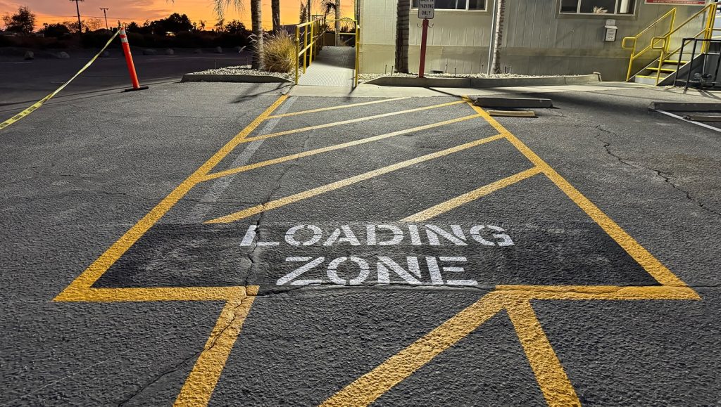 close-up of freshly painted line markings for CEMEX