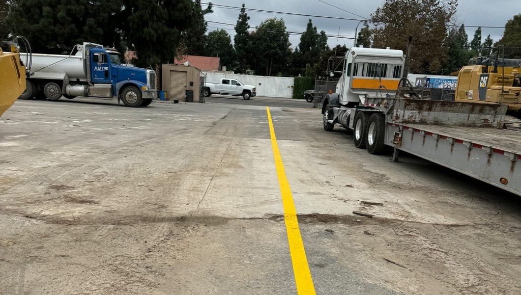 freshly painted line markings for Trench Shoring and Reed Thomas Co. parking lot