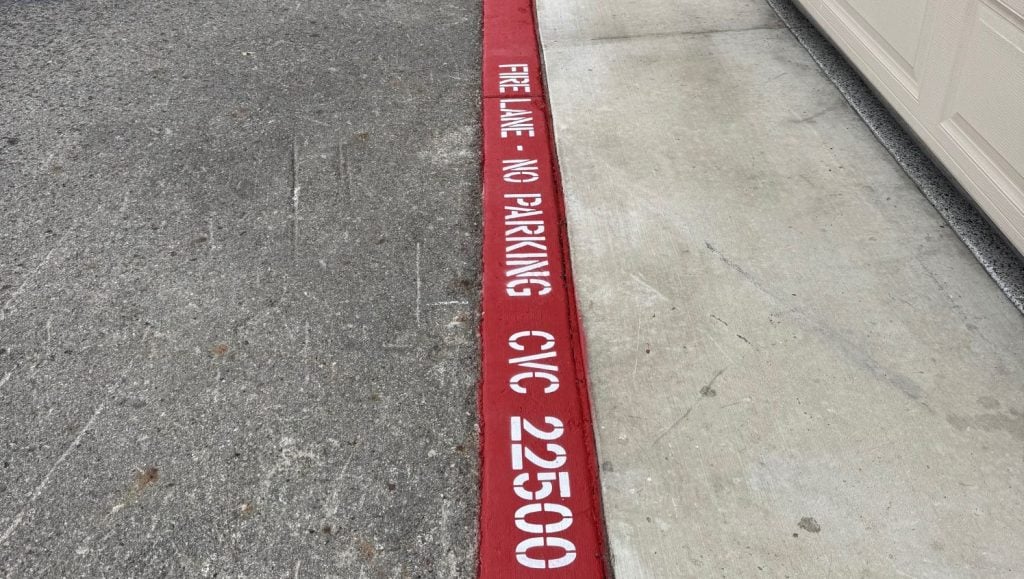 close-up of freshly painted fire lane parking for HOA
