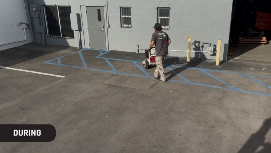 employee installing new asphalt for Quantum Freight Logistics parking lot