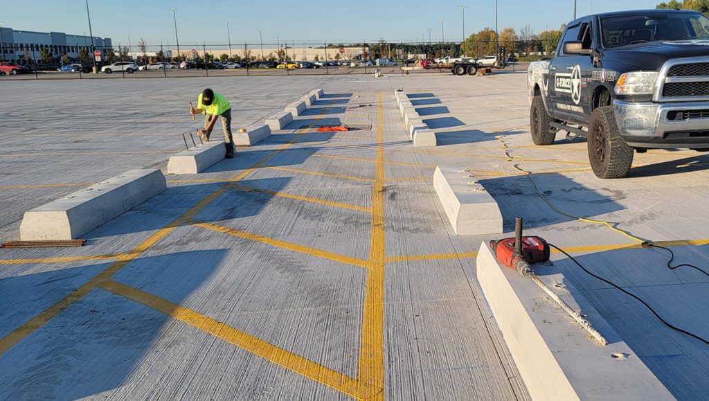 wheel stop installation in progress