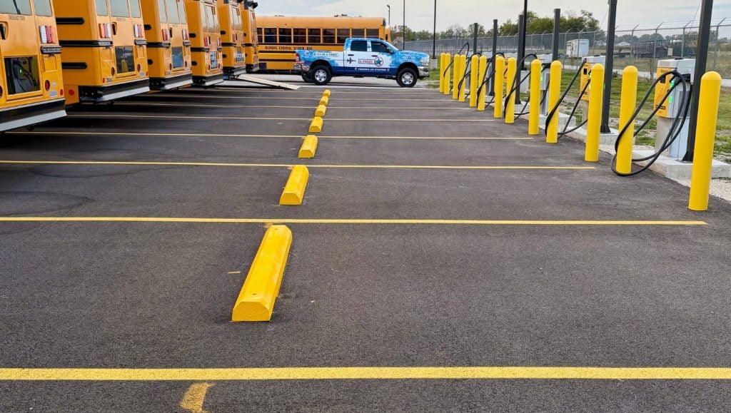 yellow parking stops installed for North America Central School Bus