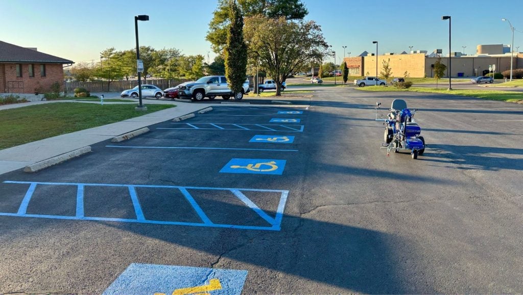 ada compliance parking spots freshly painted for Our Lady of Lourdes Catholic Church