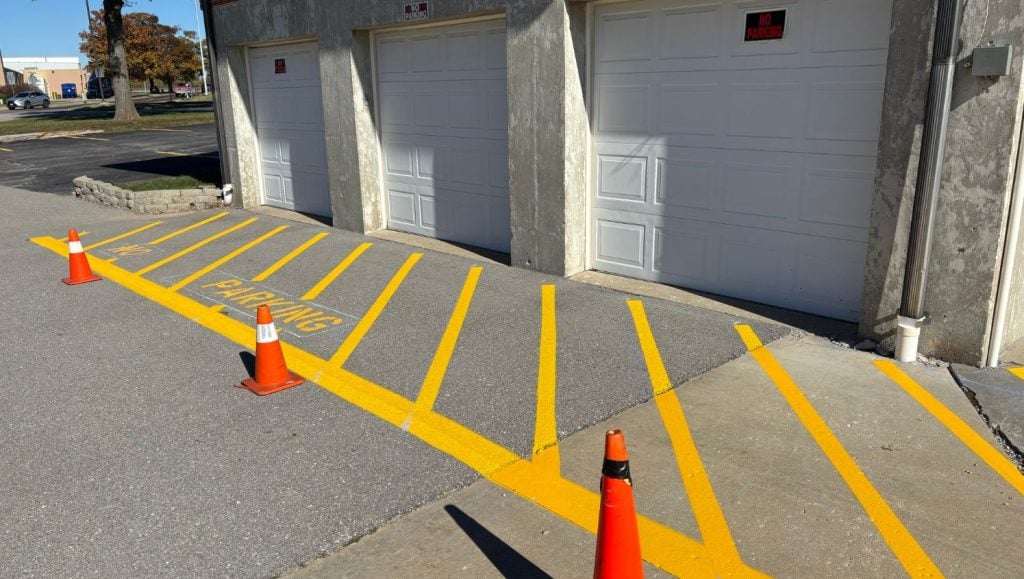 close-up of yellow line markings freshly painted for Our Lady of Lourdes Catholic Church parking lot