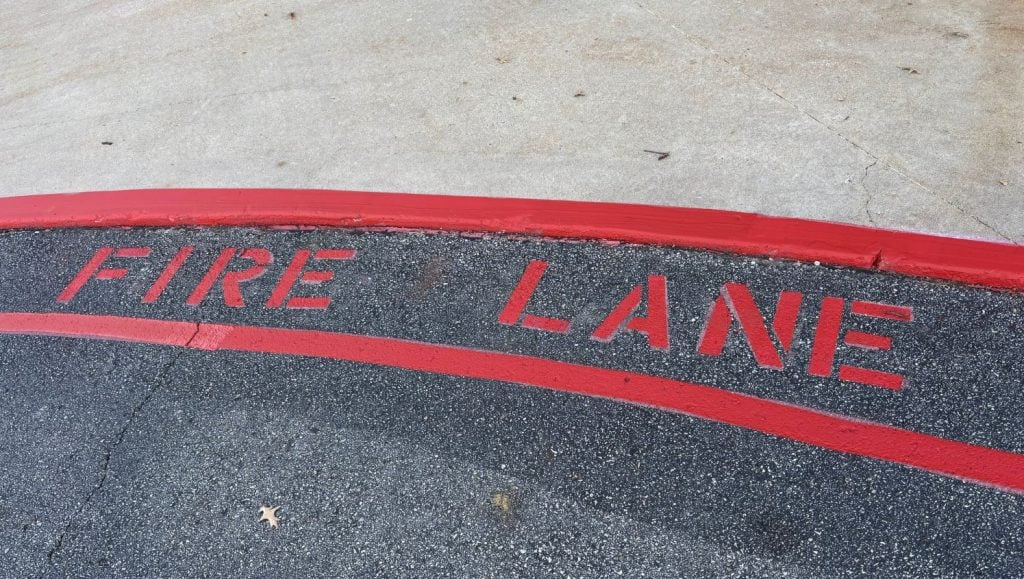 fire lane markings freshly painted for Our Lady of Lourdes Catholic Church parking lot