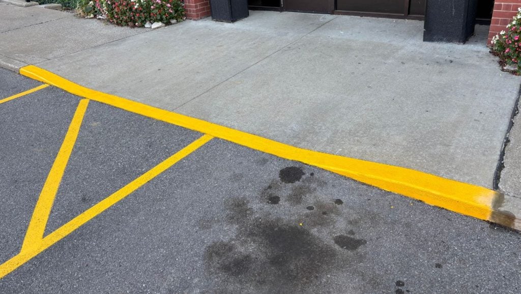 close-up of yellow line markings freshly painted for Drury Inn & Suites